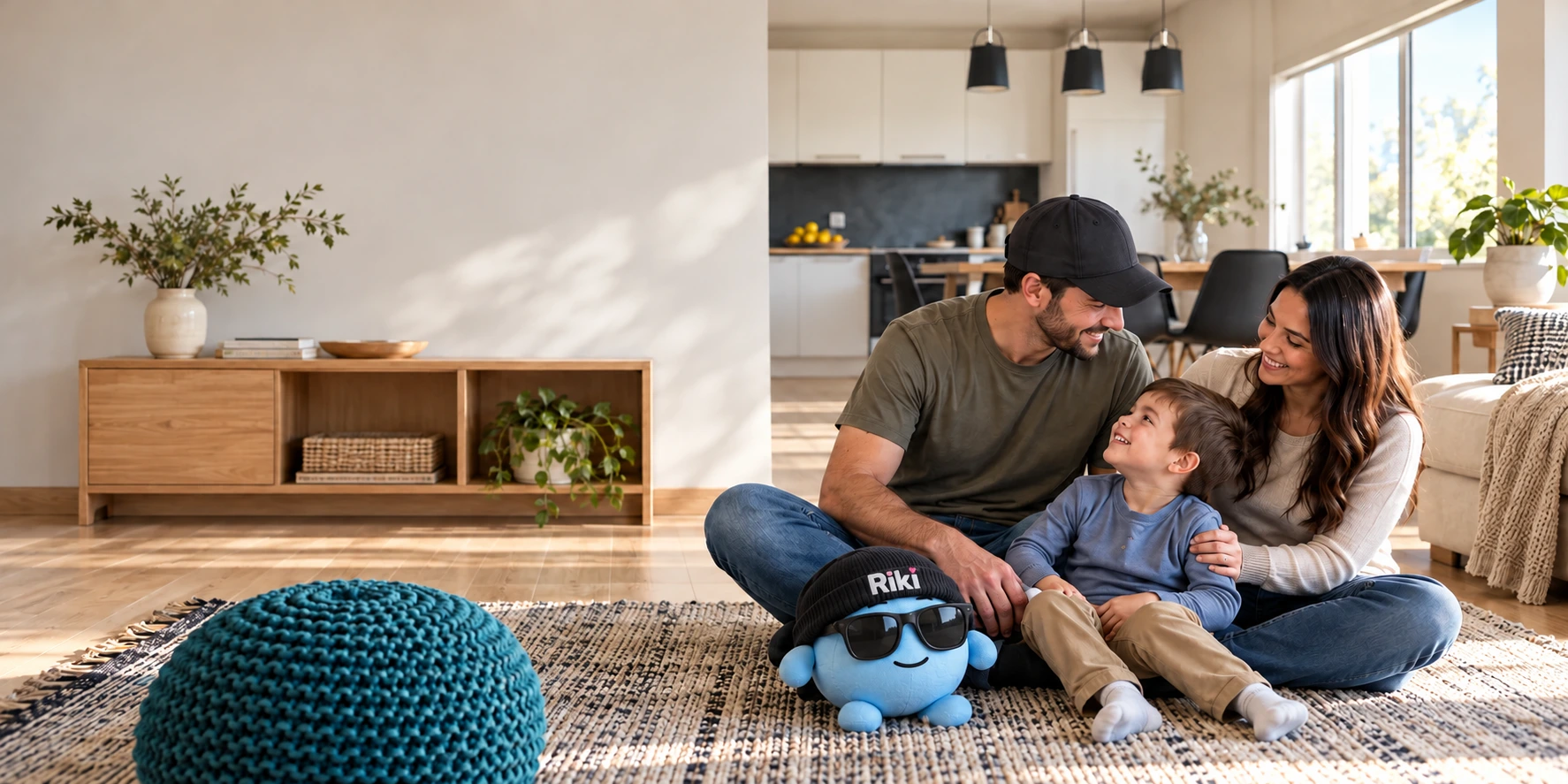 A family shares a moment in their living room, with a small blue Riki plush toy nearby